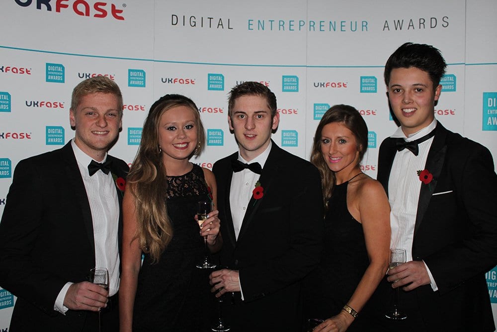 Awards group photo with the backdrop from UKFast