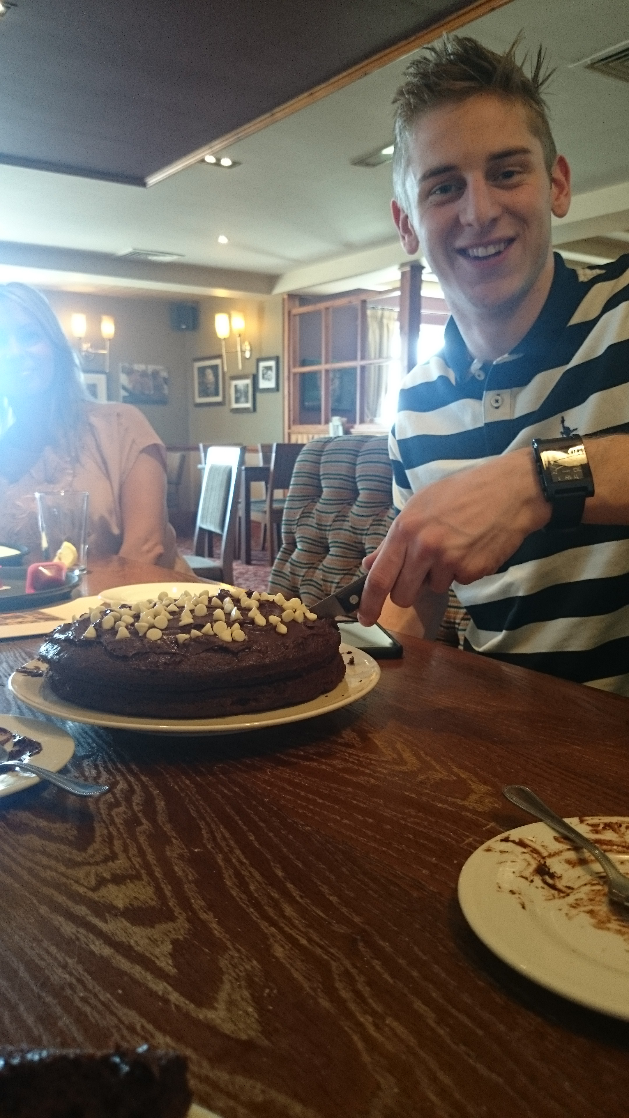 Matt cutting the cake