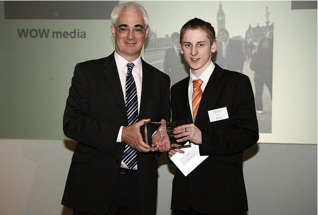 Matt Lovett receiving business award from chancellor